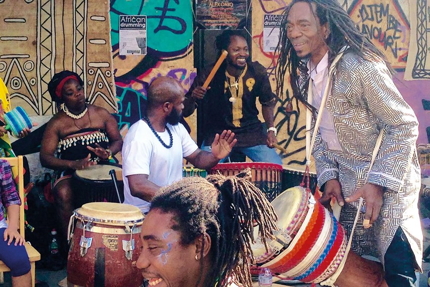 Alex Dayo and fellow drummers, including members of his band Zantogola, on a street corner during Notting Hill Carnival